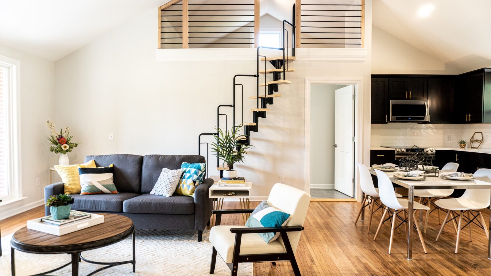 Illustrative loft-style living space with kitchen and mezzanine