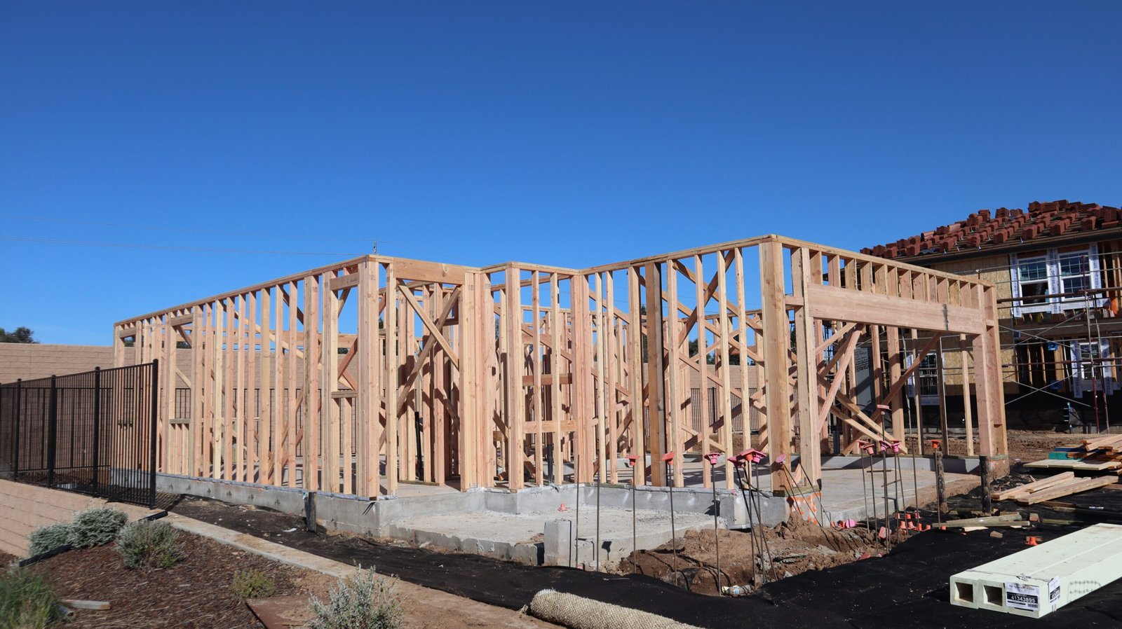 Illustrative wood-framed residential construction in progress